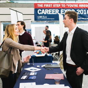 Student meeting employers at the LMU Career Expo.